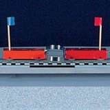 การผลักรถสองคันที่มีมวลเท่ากันออกไปด้วยสปริง