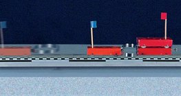 เกวียนของมวลต่าง ๆ เด้งออกไปด้วยสปริง