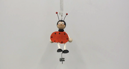 Mass dependence of the period of the motion of a toy suspeded on a spring